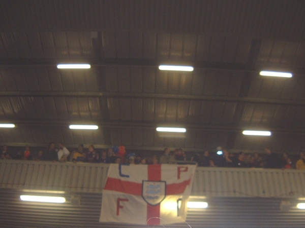 A CPFC banner is held over the side of the away stand