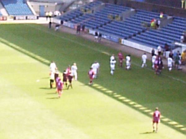 The players leave the pitch at the end of the game