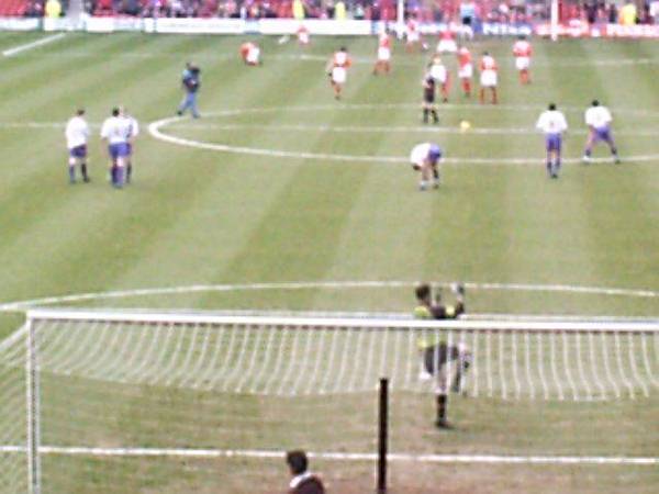 Players warm up before the start of the match