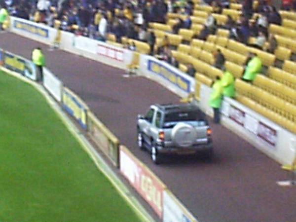 A car is paraded around the pitch at half time!